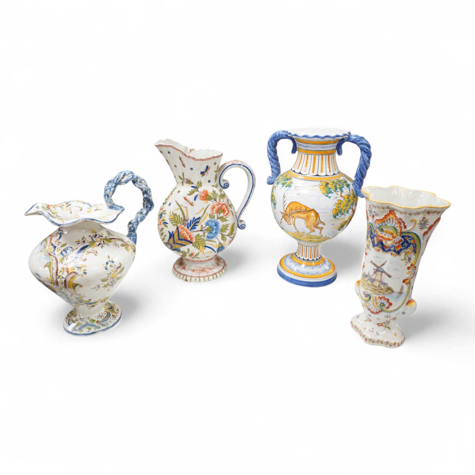 Two large French faience jugs and a vase, and a Talavera twin handled urn/vase, 44cm high